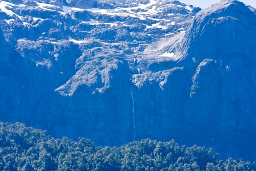 Waterfall high up in the mountains fed by melting snow