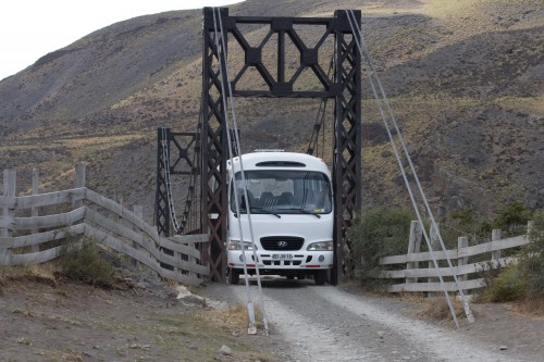 The minibus slowly squeezes across the bridge - Torres del Paine, Chile